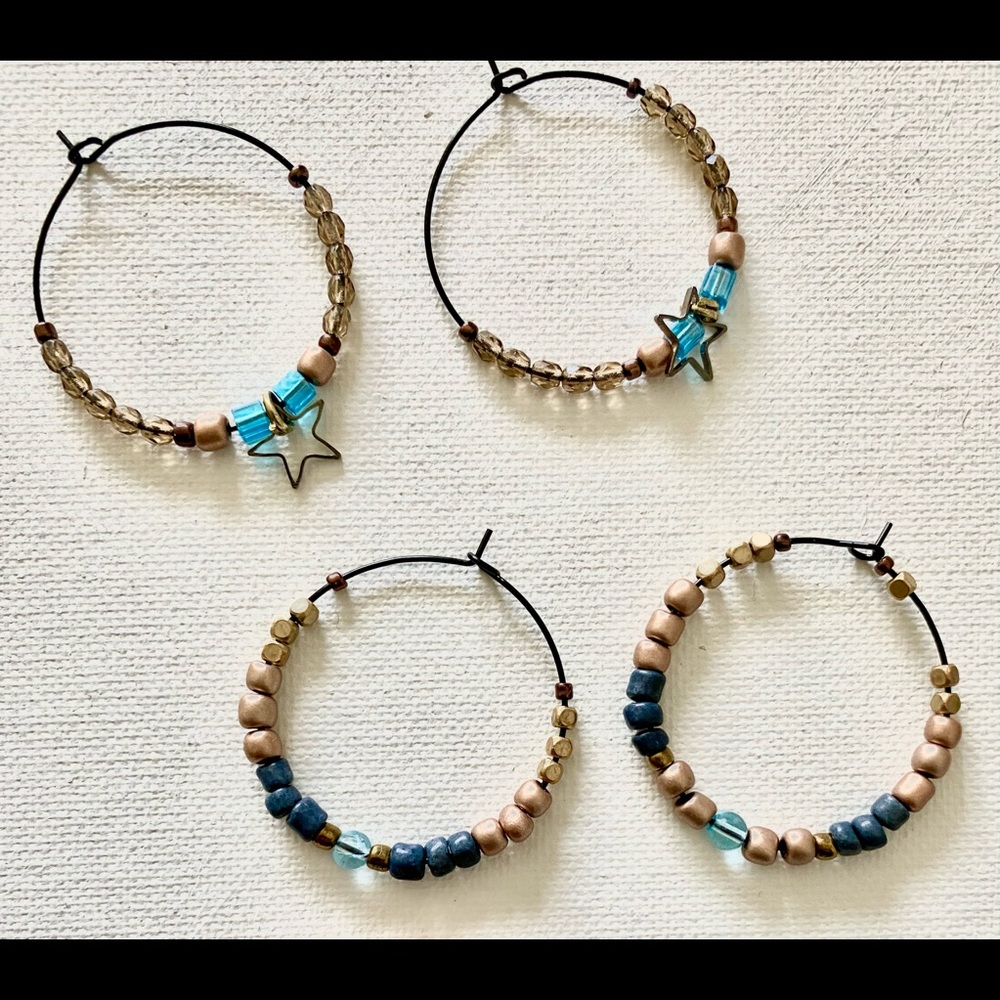 Two beaded hoop earrings rose gold colored beads with blue